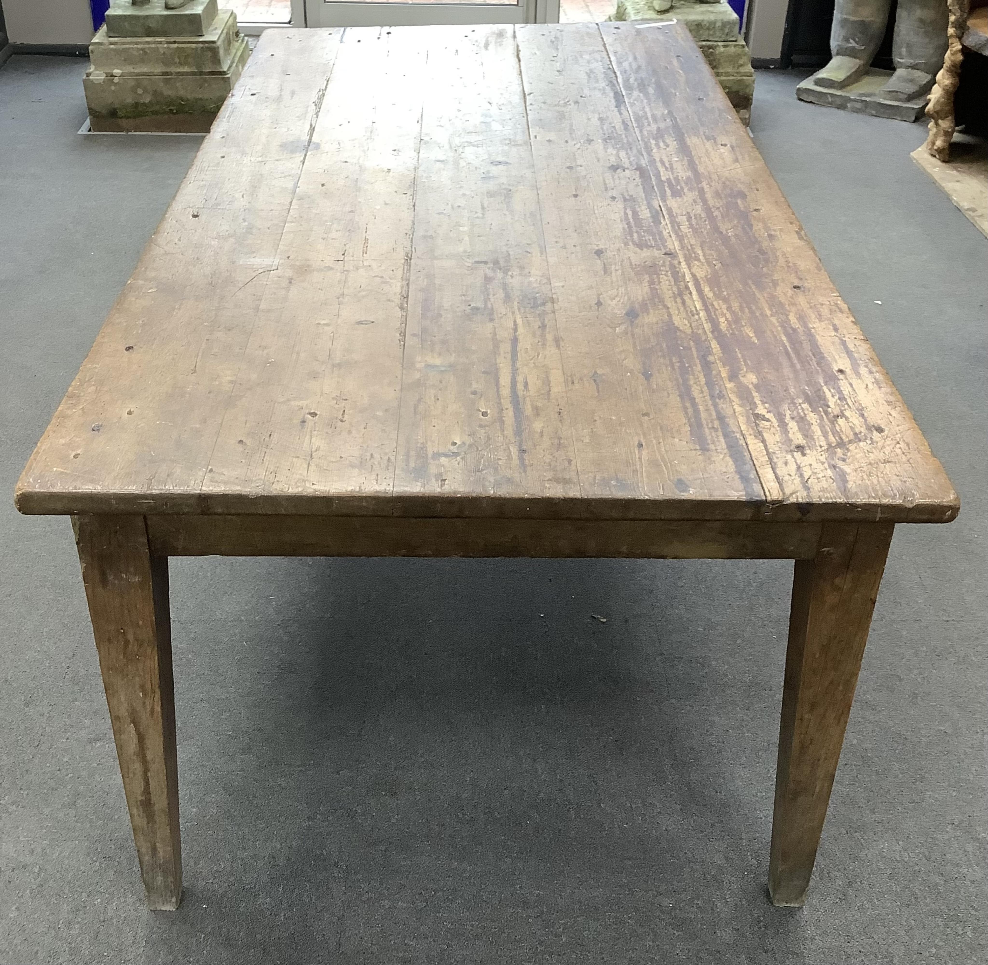 A 19th century French rectangular oak and pine kitchen table, width 198cm, depth 94cm, height 72cm. Condition - fair